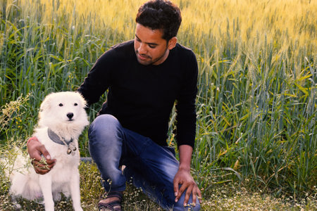 Indian rural model, photo shoot with her white dog, the morning in the wheat fields.