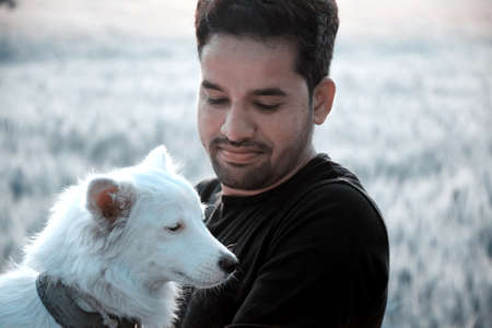 Indian rural model, photo shoot with her white dog, the morning in the wheat fields.