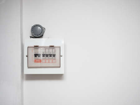 Electric safety breaker at the white wall in the house copy spaceの写真素材