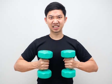 Asian man holding drumbbell feeling confident and motivation himself white backgroundの写真素材