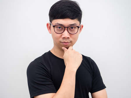 Asian man wearing glasses confident face looking at camera portrait on white backgroundの写真素材