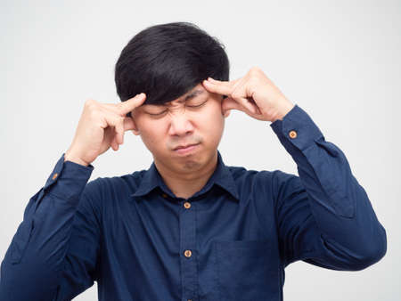 Closeup asian man touch his head feeling headache portraitの写真素材