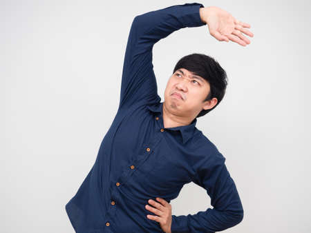 Lazy man asian stretch himself portrait white backgroundの写真素材