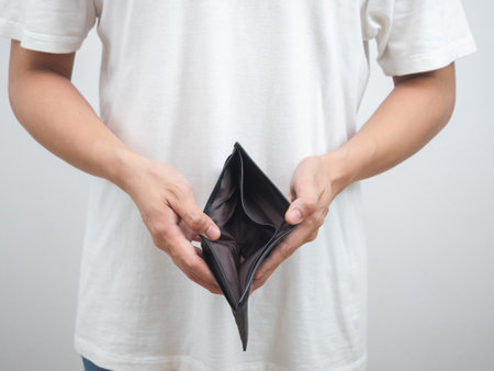 Man white shirt hand holding empty wallet portrait crop shot