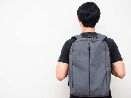 Man with school backpack stand turn back copy space white background back to school conceptの写真素材