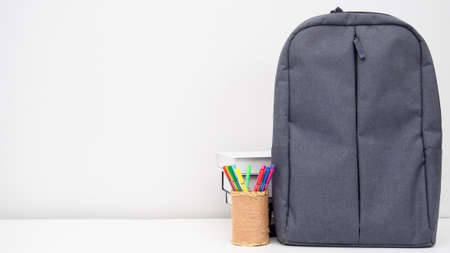 School bag with pencil box and books on the desk white background copy spaceの写真素材