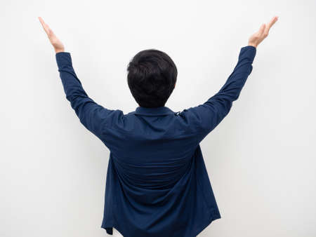 Man standing turn back show his hand up white isolatedの写真素材