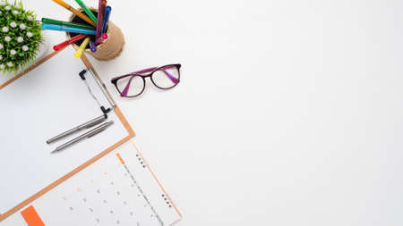 Close up pen on document poard and glasses calendar top view copy spaceの写真素材