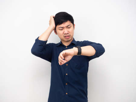 Man feeling strain touch his head about looking at his watch time late concept