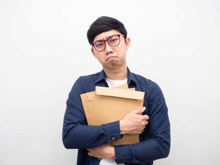 Man wearing glasses holding envelope feeling sadの写真素材