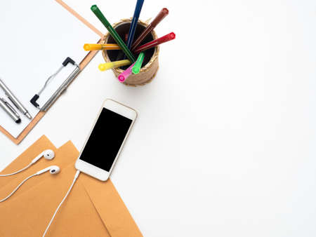 Smart phone with ear phone,wood board document and envelope top view copy space