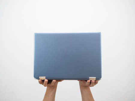 Man hand holding laptop isolated whiteの写真素材