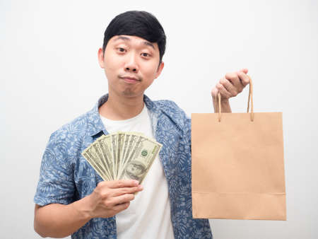 Man holding a lot of money gesture happy shoppingの写真素材