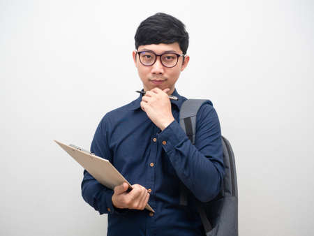 Businessman wearing glasses holding document board with bag gesture confidentの写真素材