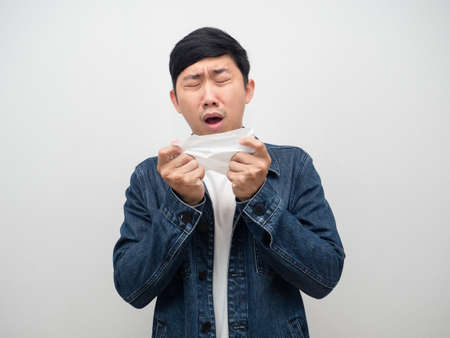 Sickness man jeans shirt cough in tissue paper,sickness asian manの写真素材