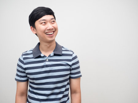 Cheerful man happiness smile looking at copy space,Man striped shirtの写真素材