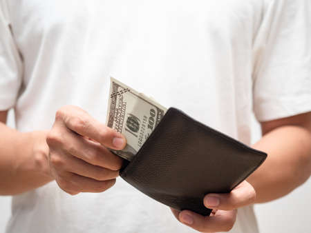 Close-up male hand pick up dollar money from his wallet