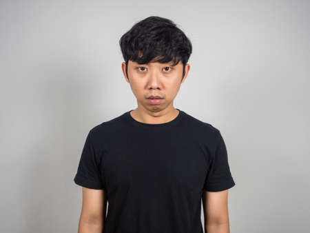 Man feels tried from working looking at camera portrait,Hopeless manの写真素材