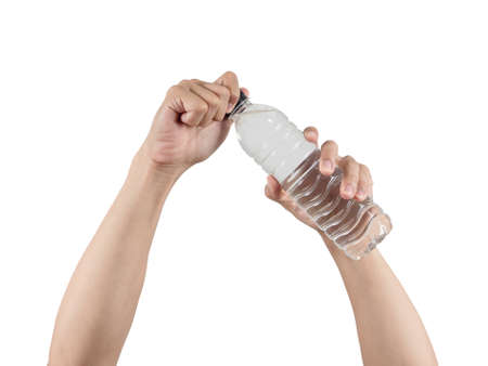 Hands opening water bottle cap isolatedの写真素材