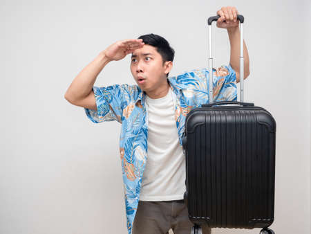 Asianl man beach shirt hold luggage gesture looking feels excitedの写真素材
