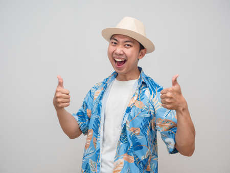 Positive man wear hat beach shirt gentle smile double  thumb upの写真素材