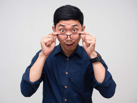 Businessman gesture take off glasses for looking at camera isolatedの写真素材