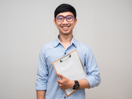 Young businessman hold document board smile face portraitの写真素材