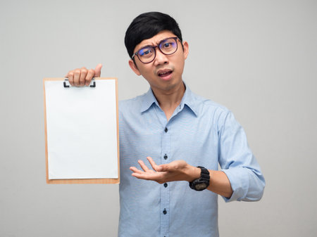 Businessman serious emotion show blank document board isolatedの写真素材