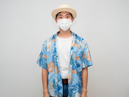 Toursim man beach shirt wear hat standing portrait studio shot isolatedの写真素材