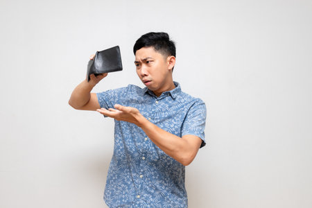 Asian poor man gesture shake his wallet find money feels sad isolated