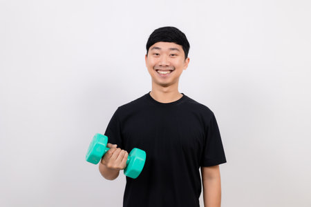 Asian man black hold dumbbell for exercise happy smile isolatedの写真素材