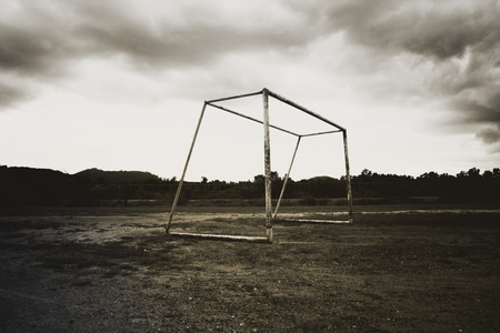 View of old abandoned football goal post standing on field for concept of visual.の写真素材
