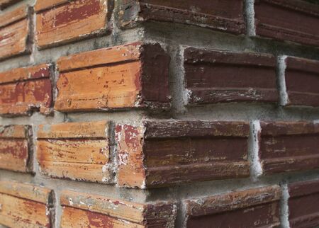 Two side of vertical brick column. bright side and dark sideの写真素材