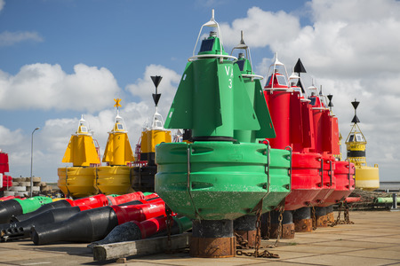 Colored navigation buoys in maintenance and storageの写真素材