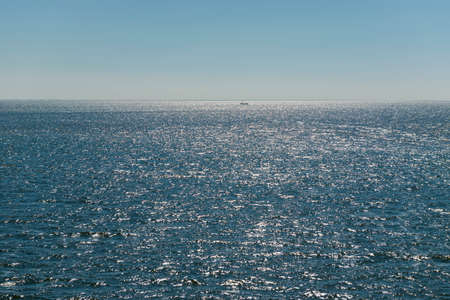 Sun over the Wadden Sea with fishing boatの写真素材