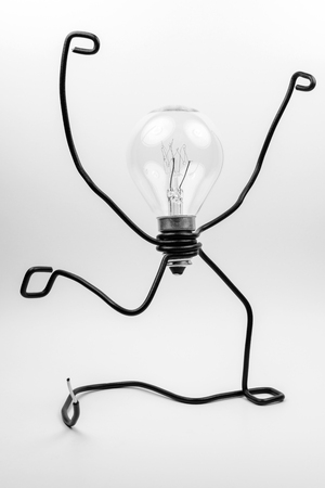 Emotional fantasy figure of a transparant light bulb and black electrical wiresの写真素材
