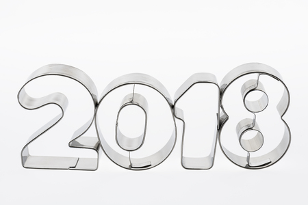 Text two thousand eighteen in metal put figures on a white background as a visualization of the...