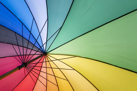 Colorful parasol in summer with backlightの写真素材