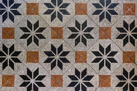 Green tractor picking up cut grass with a green loader wagon in the summer in the Netherlandsの写真素材