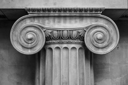 Top of an Ionic column in black and white