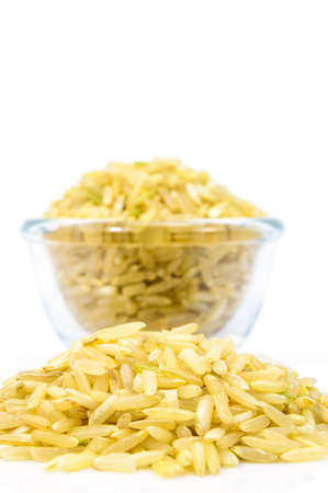 Brown Rice in a glass bowl on white background の写真素材