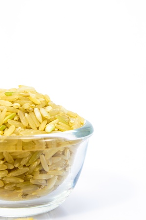 Brown Rice in a glass bowl on white background の写真素材