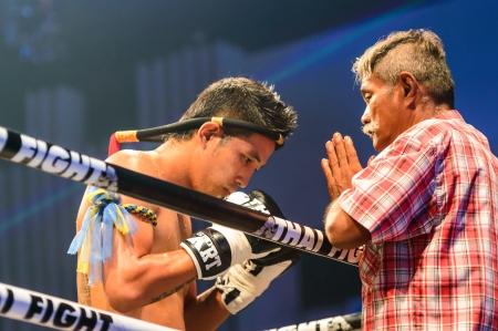 BANGKOK - JUNE 29   Coach Praying before the match for Sudsakorn Sor  Klinmee of Thailand in Thai Fight Extreme 2013 on June 29, 2013 at MCC Hall, The Mall, Bangkapi, Bangkok, Thailand のeditorial素材