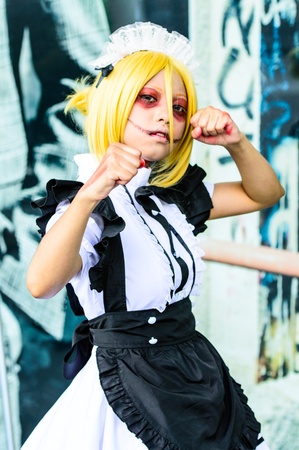 BANGKOK - AUGUST 31   Cosplayer as characters Annie Leonhardt maid version from Attack on Titan in Japan Festa in Bangkok 2013 on August 31, 2013 at Central World, Bangkok, Thailand のeditorial素材
