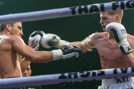 BANGKOK - NOVEMBER 30   Ruslan Kushnirenko of Ukraine and Jimmy Vienot of Switzerland in Thai Fight 2013 on November 30, 2013 at MCC Hall, The Mall, Bangkapi, Bangkok, Thailand のeditorial素材