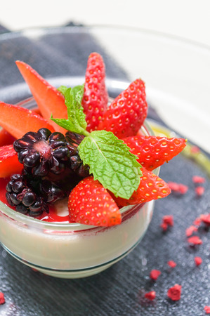Italian Dessert, Panna Cotta Decorated with Strawberry and Mint の写真素材