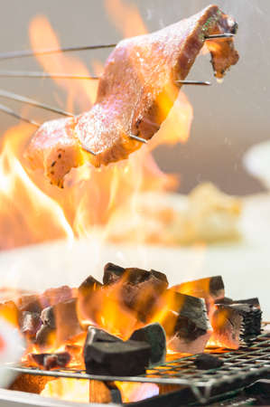 Tuna on the flaming grill の写真素材