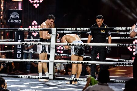 BANGKOK - DECEMBER 24 : Payak-Samui Lukiaoporongtom-Kromsappasamit of Thailand and Bobur Tagaev of Uzbekistan in THAI FIGHT 2016 on December 24, 2016 at Central World, Bangkok, Thailand.のeditorial素材