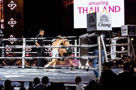 BANGKOK - DECEMBER 24 : Petch-Samui Lukiaoporongtom-Kromsappasamit of Thailand and Albert Amirdzhanyan of Russia in THAI FIGHT 2016 on December 24, 2016 at Central World, Bangkok, Thailand.のeditorial素材