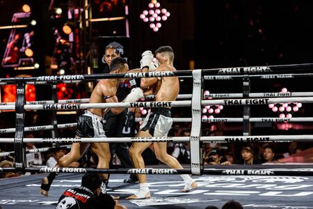 BANGKOK - DECEMBER 24 : Saenchai P.K.Saenchai Muay Thai Gym of Thailand and Julio Lobo of Brazil in THAI FIGHT 2016 on December 24, 2016 at Central World, Bangkok, Thailand.のeditorial素材